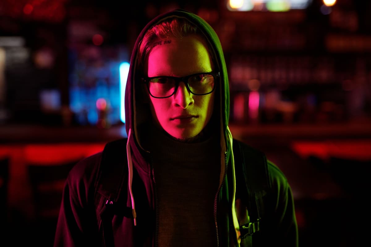 close up of an intense gamer face under neon light