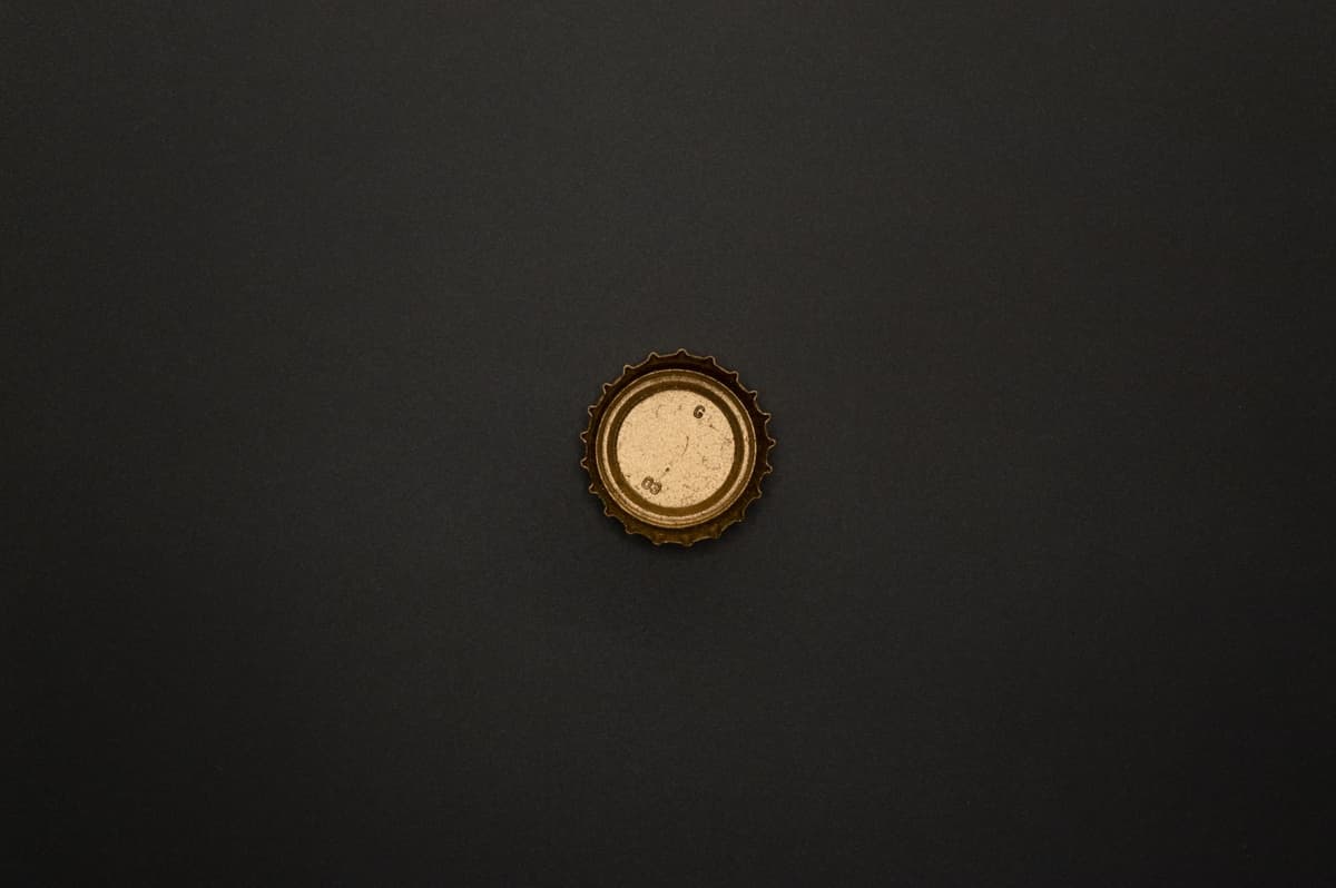 a single metallic battery cell floating in dark void