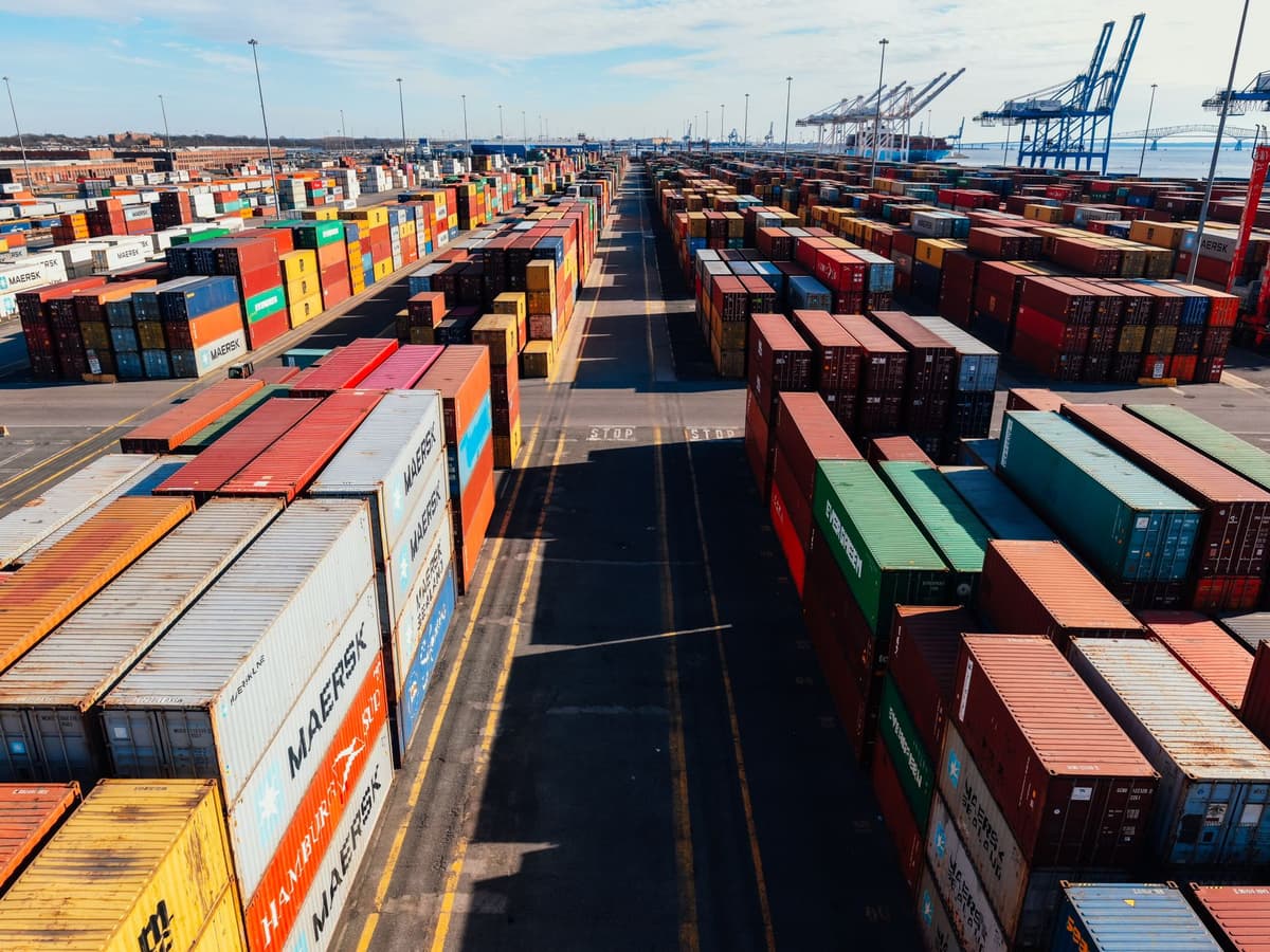 row of new electric hatchbacks at shipping port