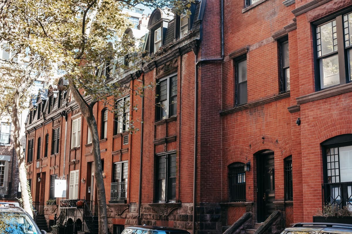 a narrow four story brick house squeezed between buildings