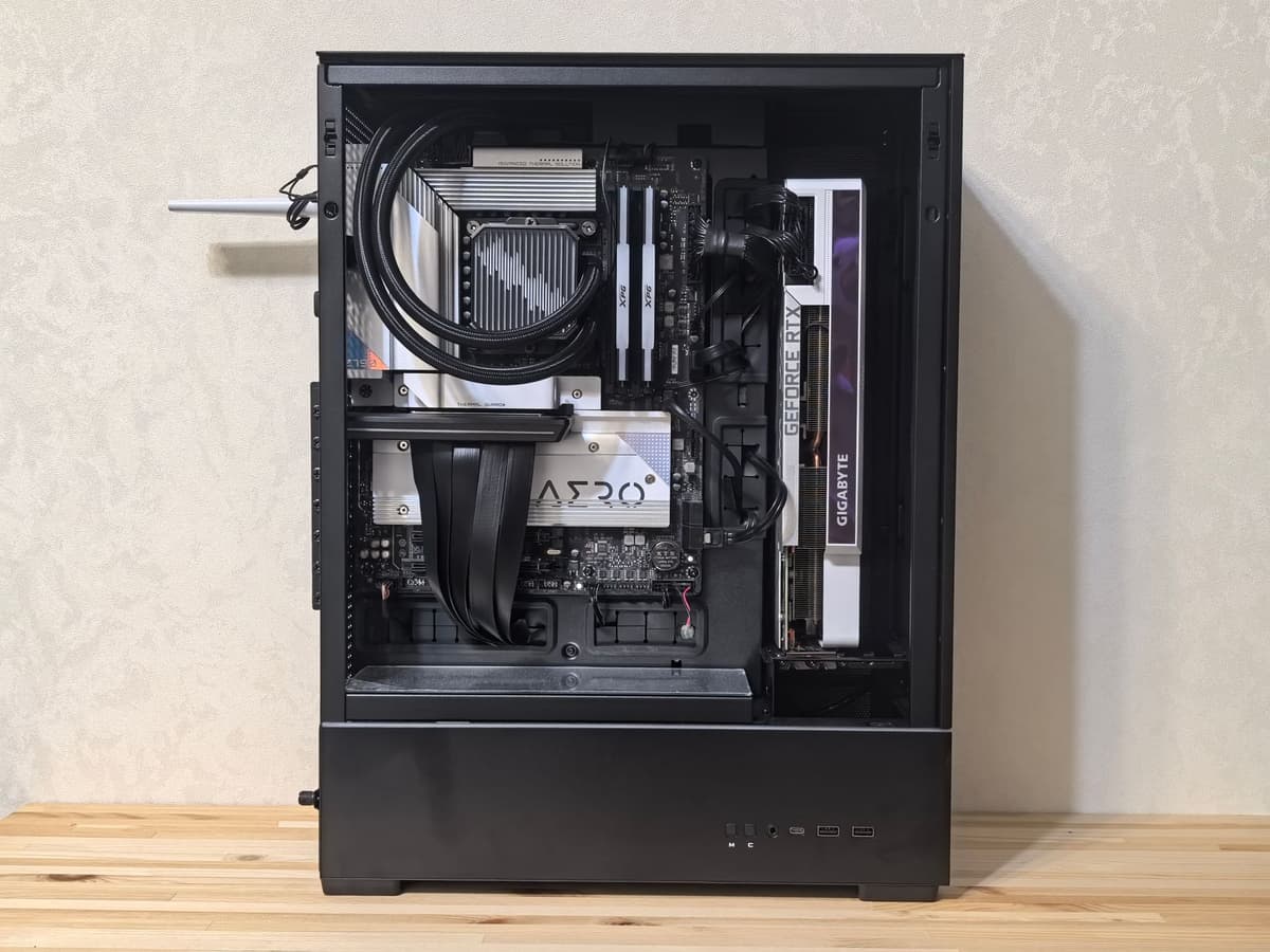 a high-end gaming PC tower filled with glowing green liquid and a single carrot float inside