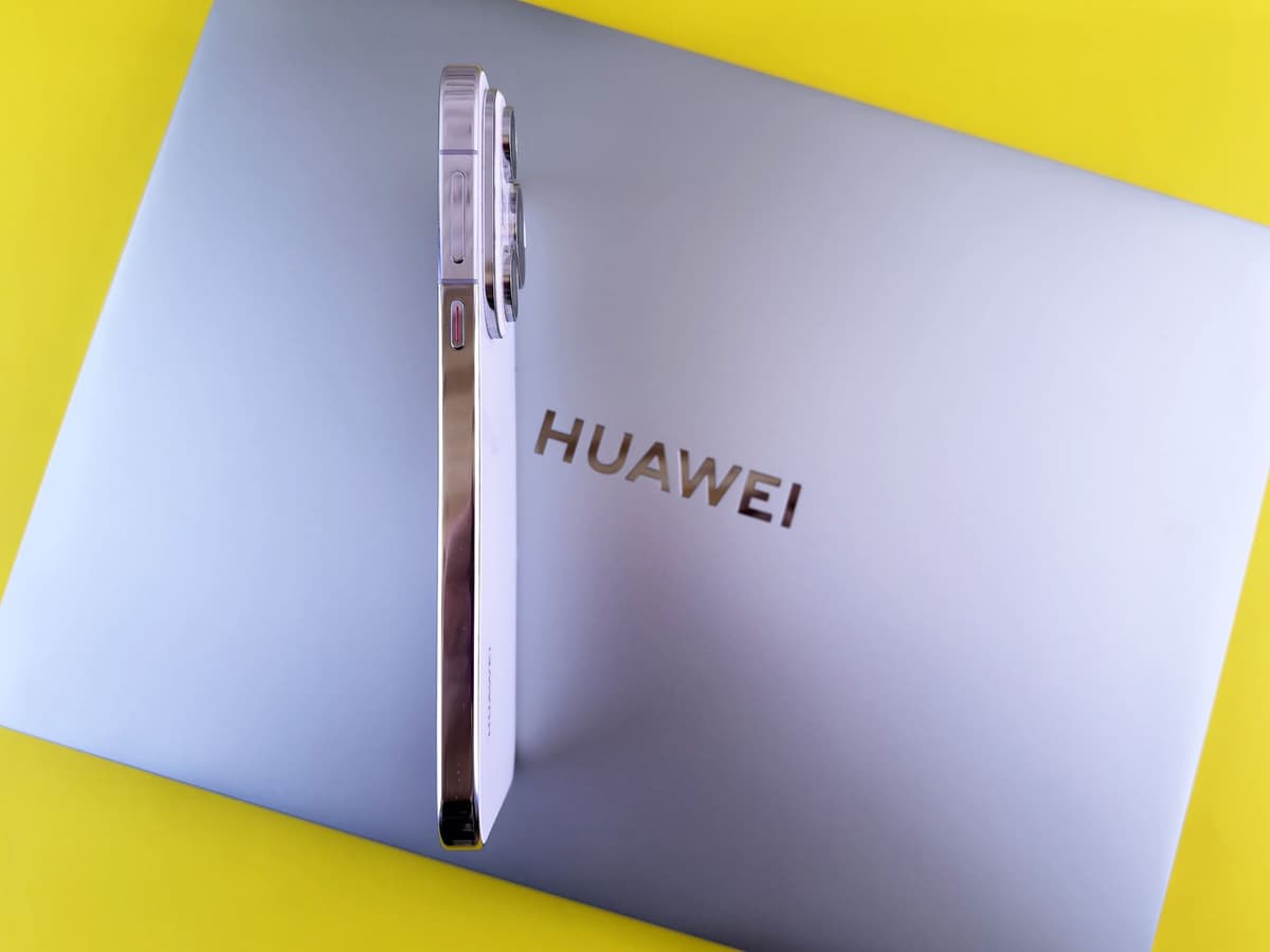 a dusty crystal ball sitting next to a sleek silver laptop