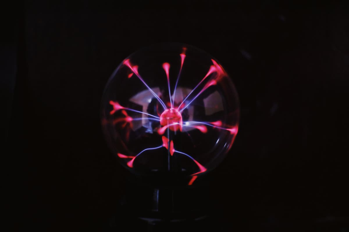 a glowing orange sphere with jagged white light loops