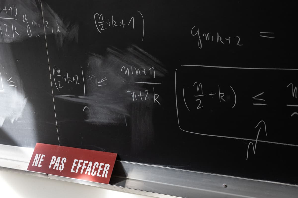 vintage blackboard covered in chalk differential equations
