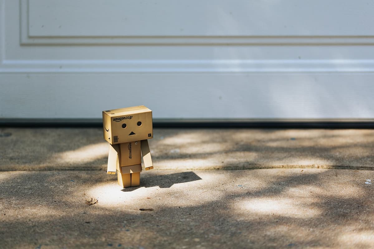 a dusty cardboard box labeled 'Mars' with a $11,000,000,000 price tag stuck on it