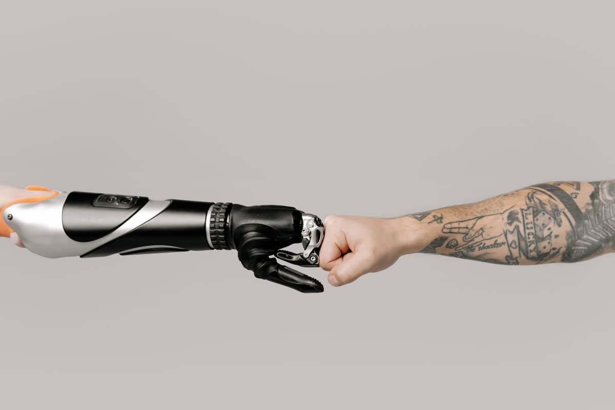 a robotic surgical arm hovering over a silicon organ model