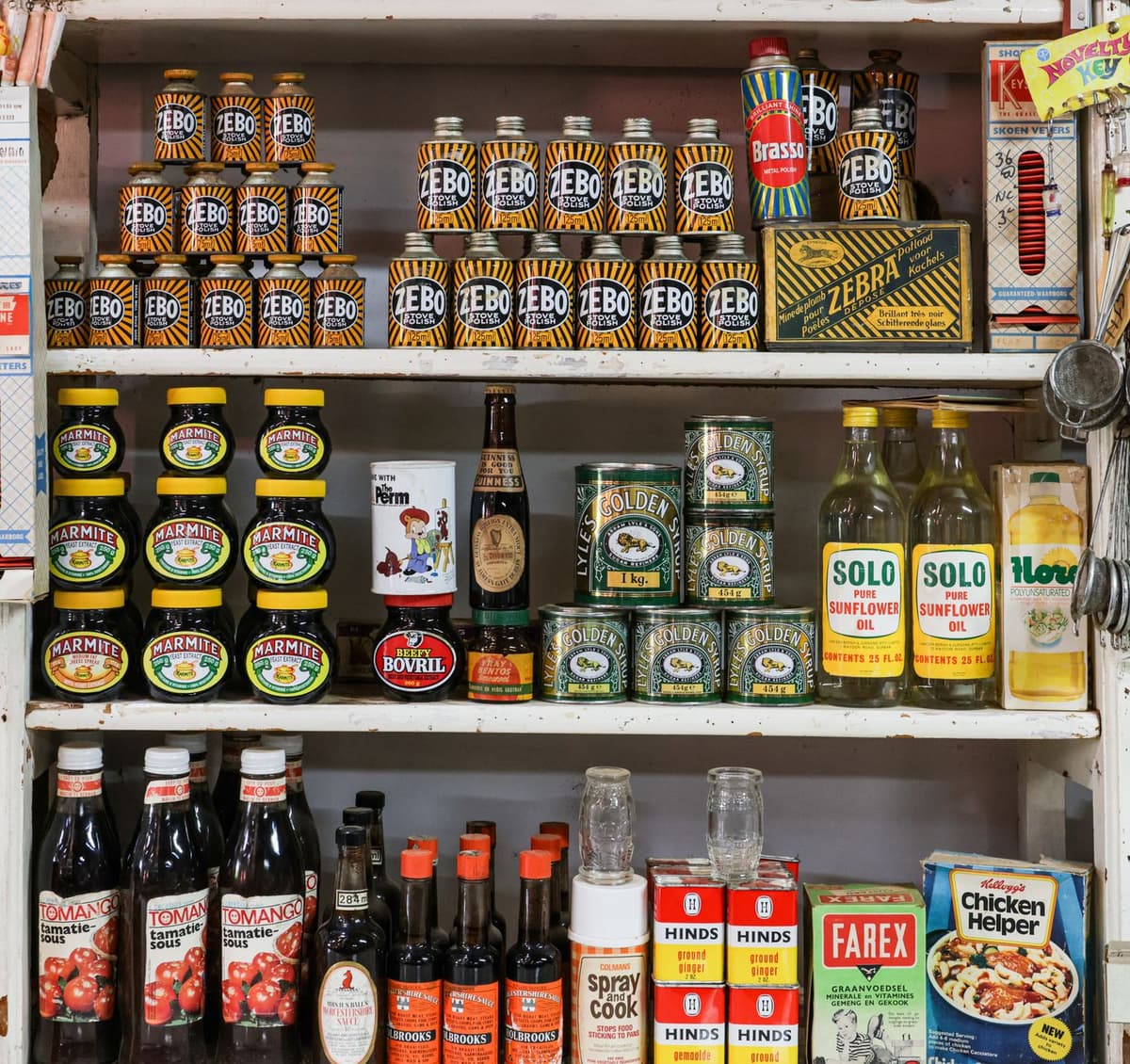 vintage grocery store shelves lined with identical unlabeled soup cans