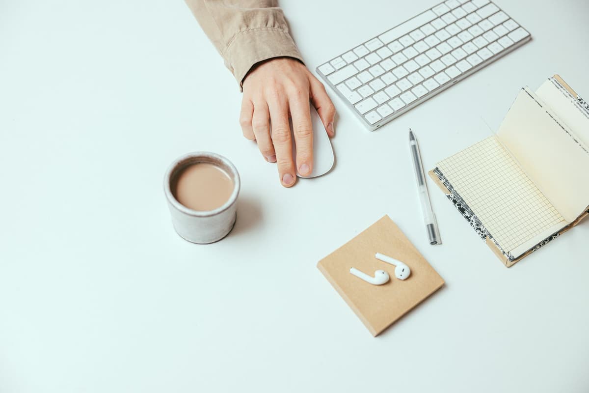 a hand straining to move a tiny mouse cursor onto a hairline thin line