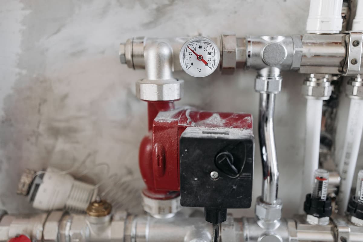 a stainless steel pipe manifold with pressure gauges