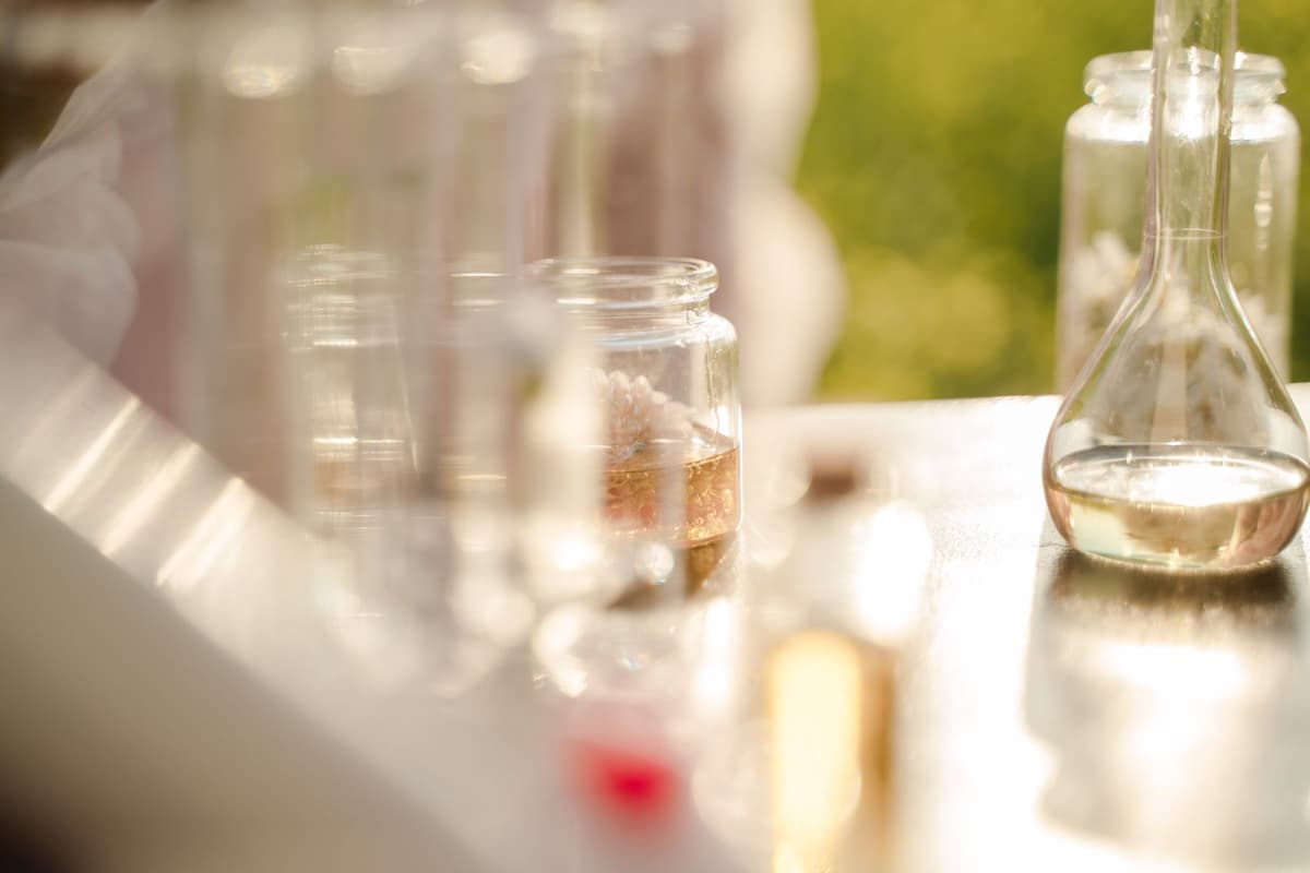 a vintage laboratory beaker filled with pink glittery liquid