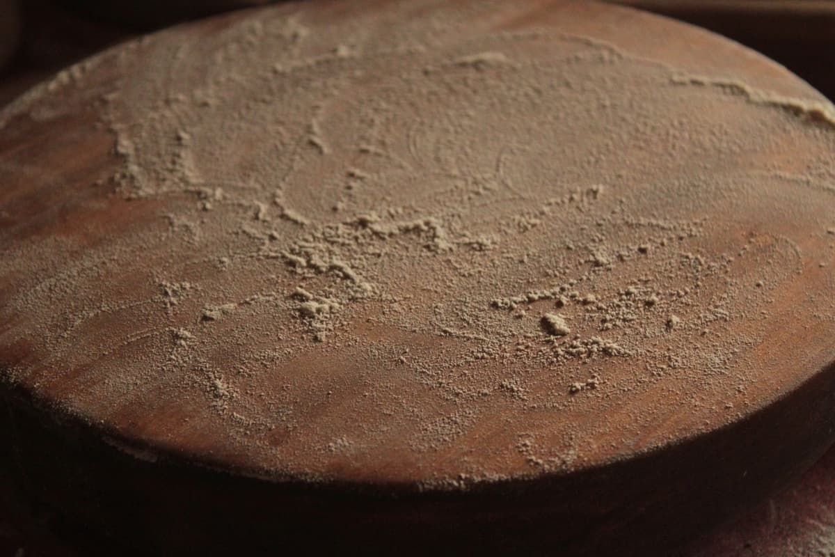 wooden mooncake press on floured pastry board