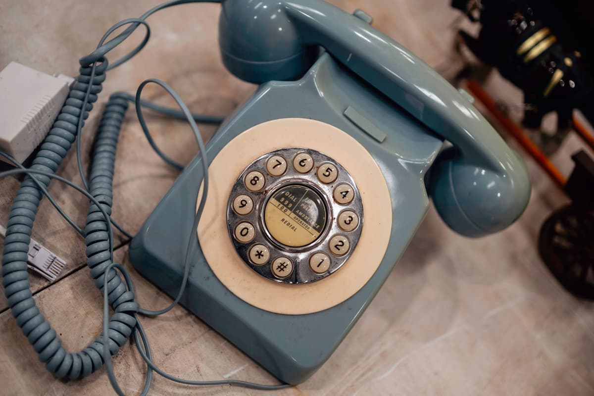 vintage rotary telephone tangled in server wires