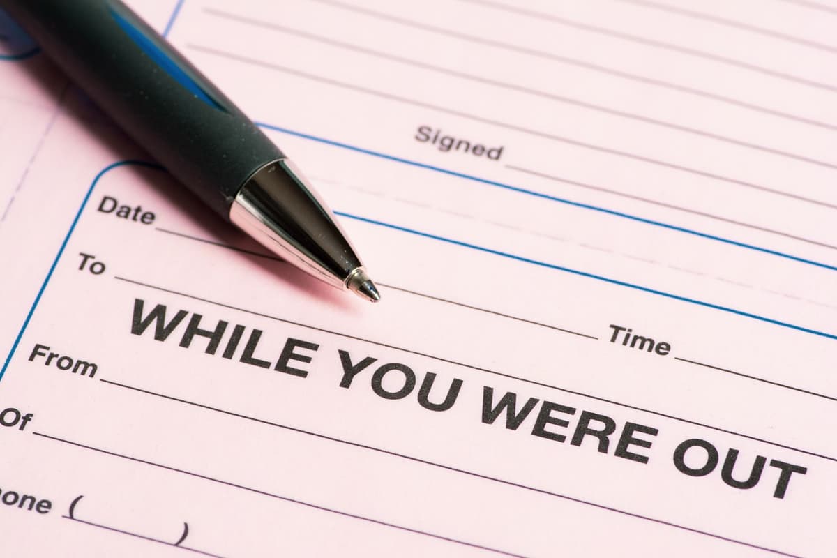a close-up of a pen hovering over a blank feedback form