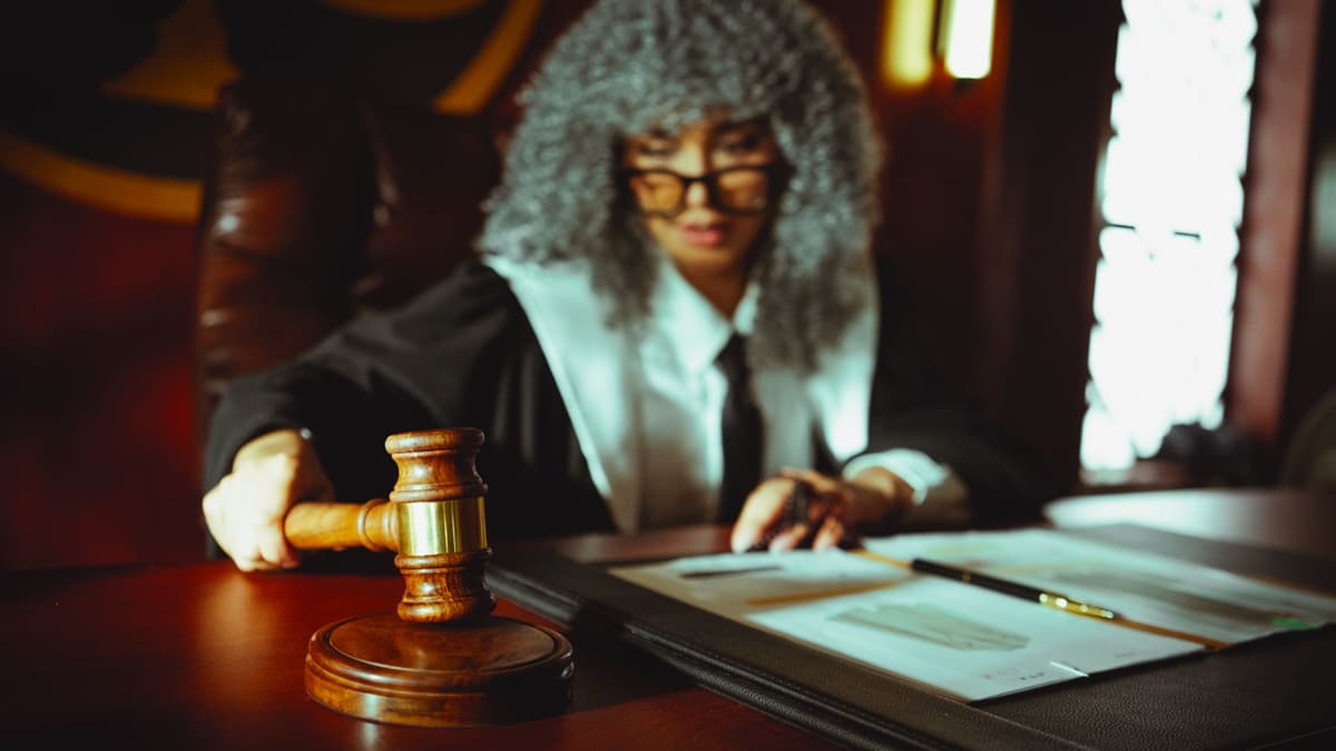 old dusty legal document with a brass gavel