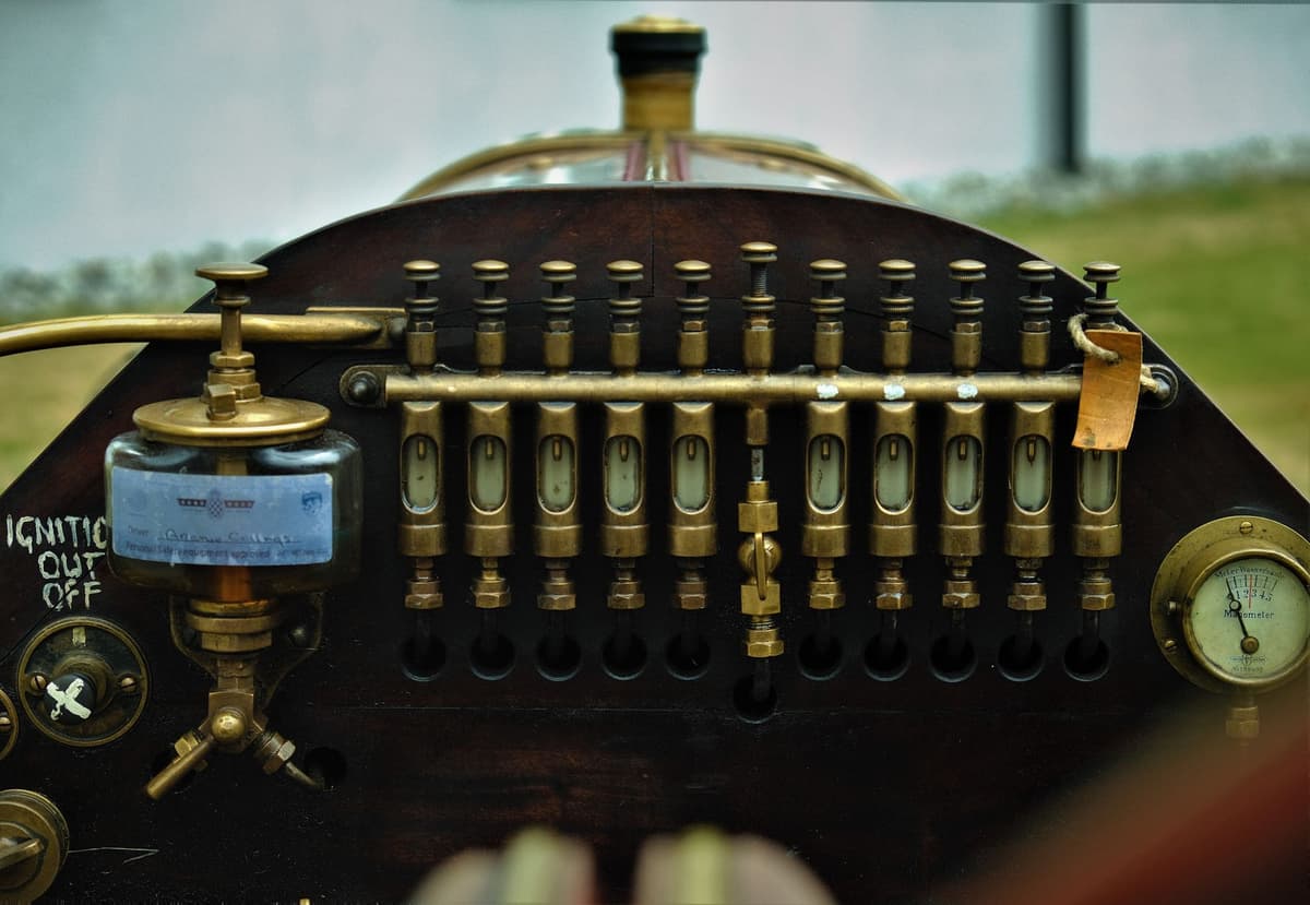 antique magnetometer with brass dials and paper ledger