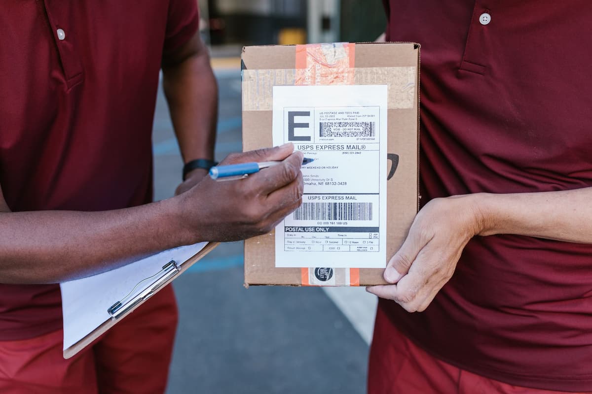 a thermal label printer spitting out a long roll of shipping labels