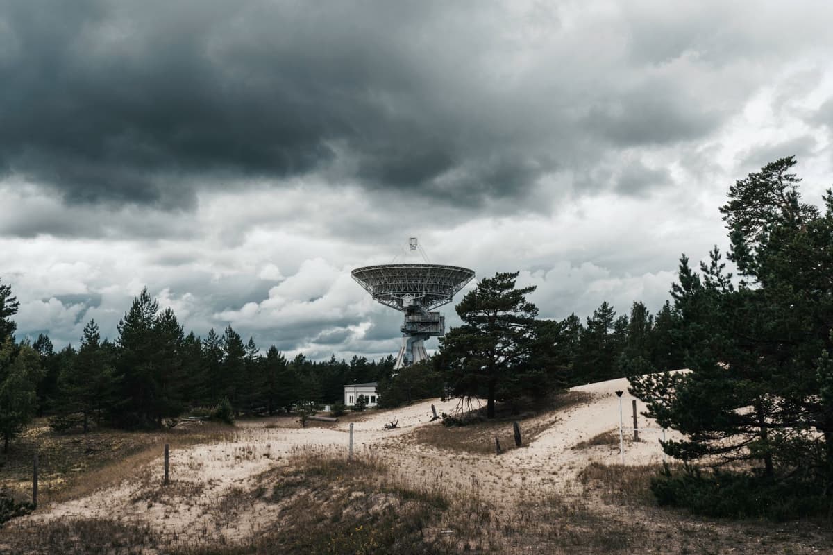 a high-resolution radar dish pointed at a night sky