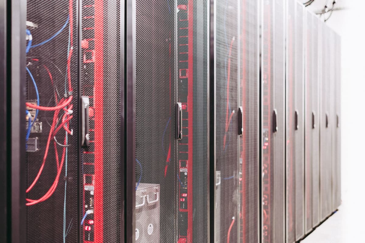 a single gray server rack in a dark room