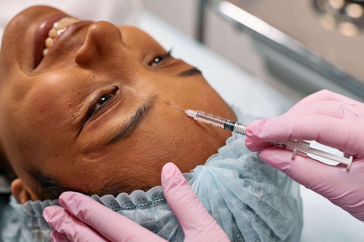 close up of hyaluronic acid filler syringe on stainless tray