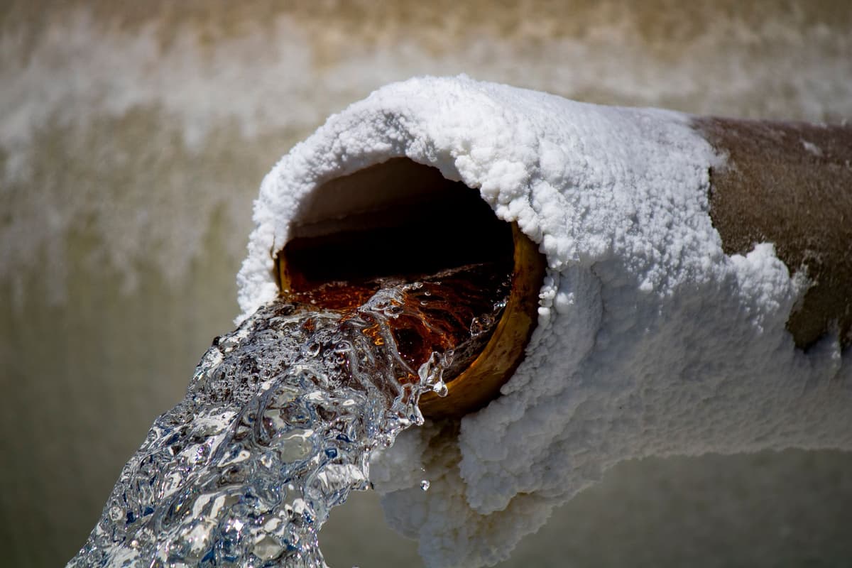 a massive cooling pipe dripping with condensation