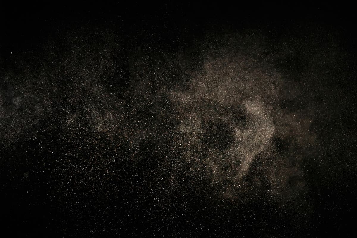 metallic dust glinting in the upper atmosphere sun