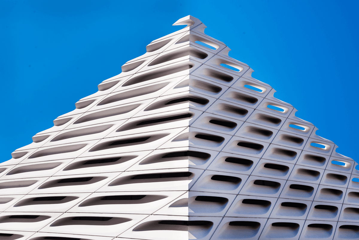 modern building facade with integrated geometric wildlife cavities