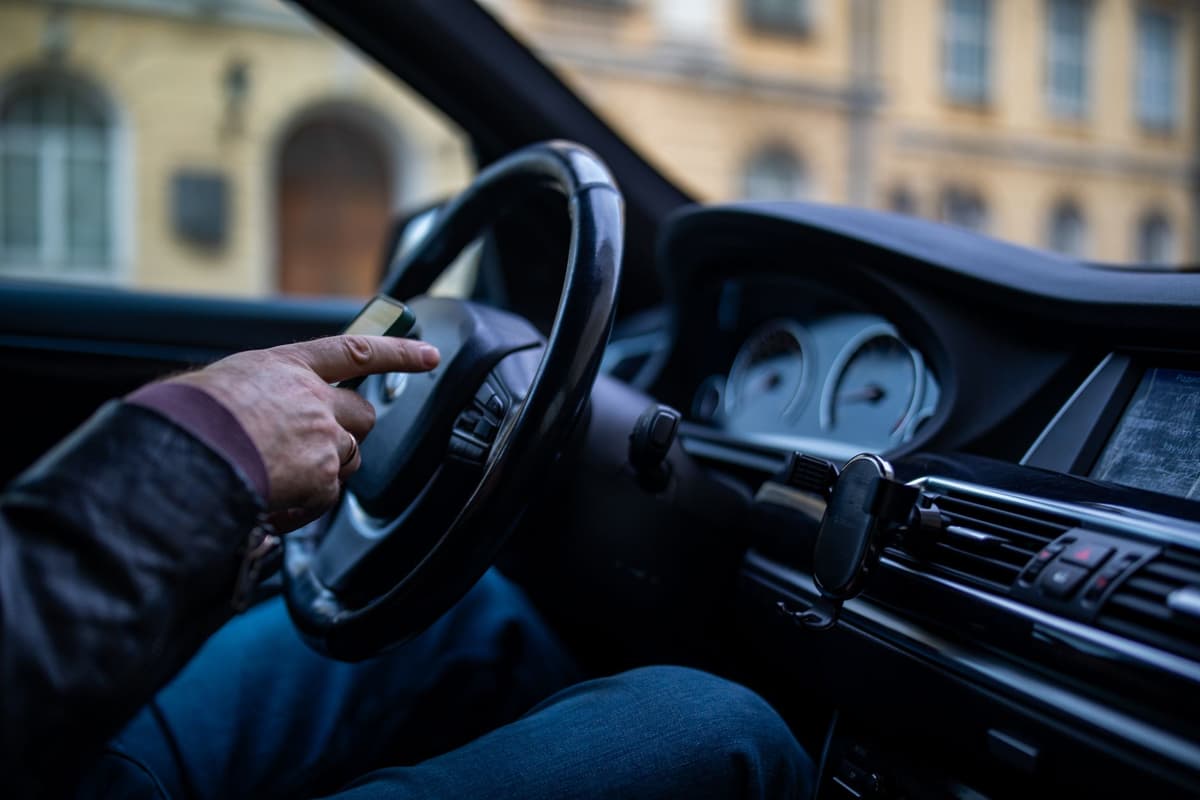 a frustrated driver staring at a blank digital dashboard