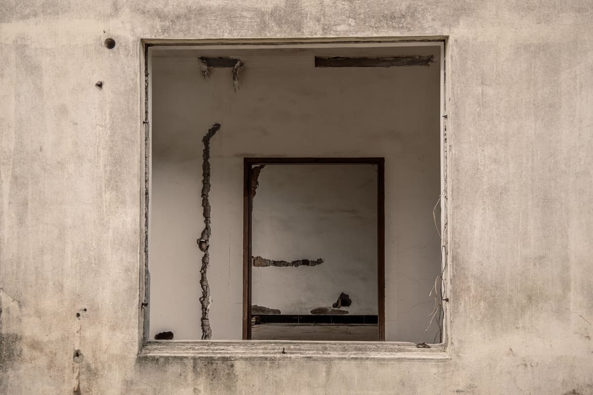 vintage laboratory glassware inside an abandoned concrete building
